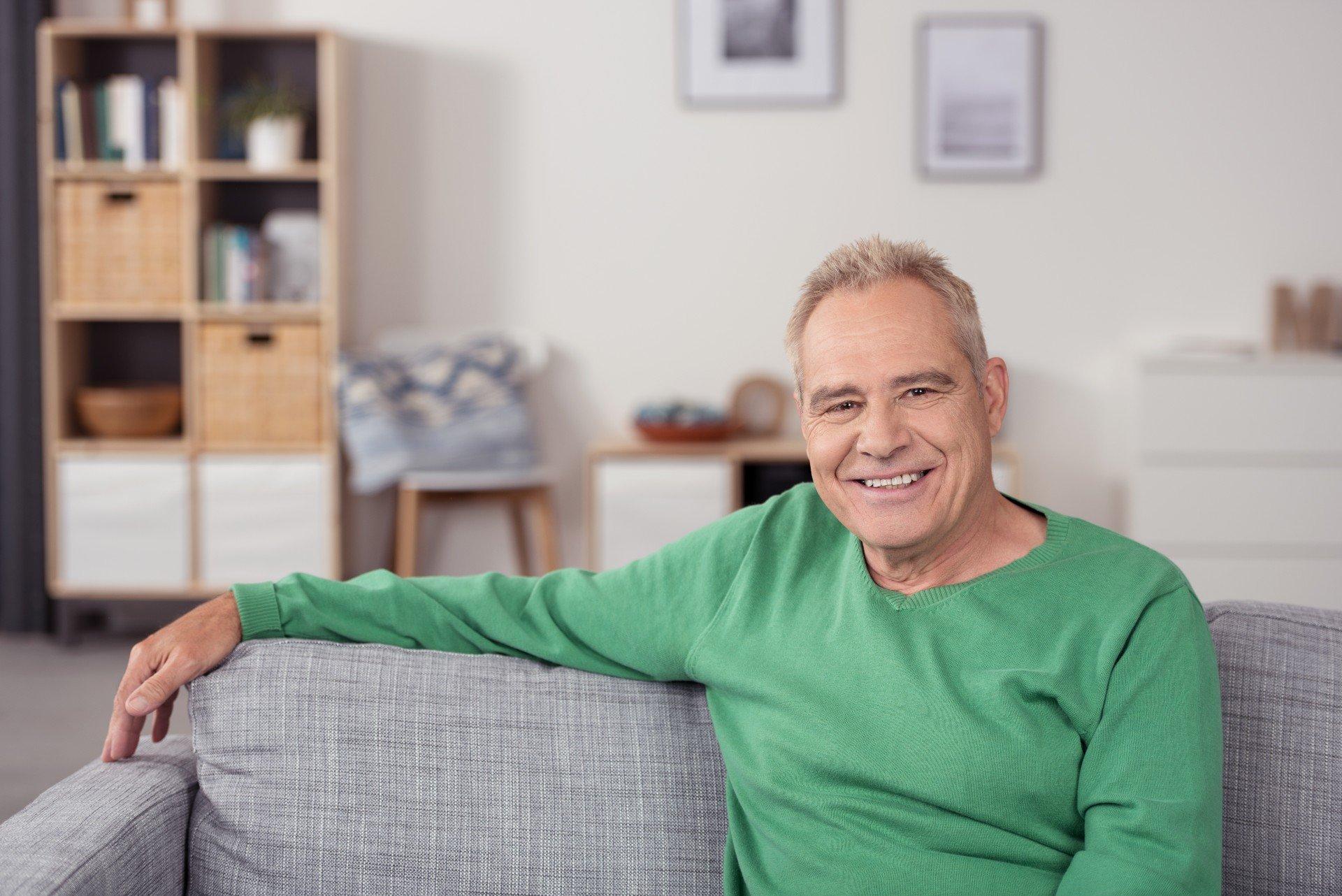 older adult man smiling